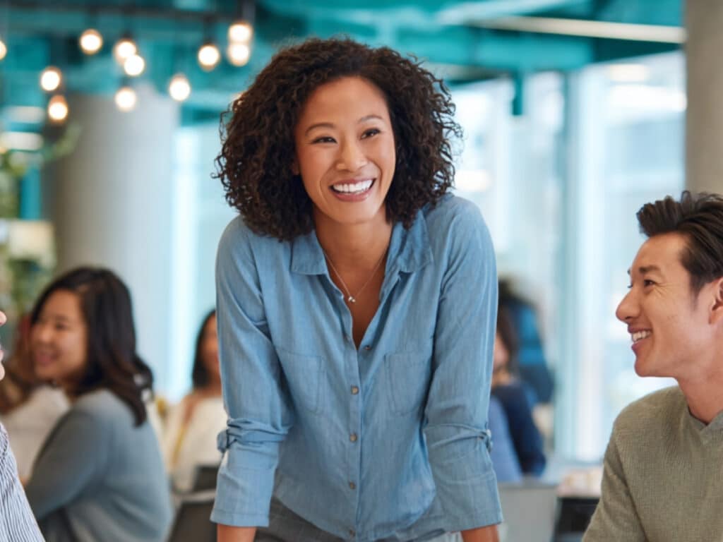 Woman standing at conference table